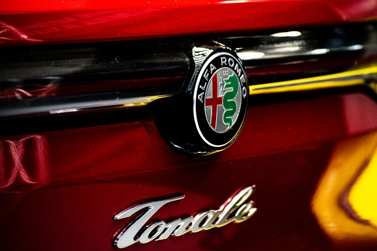 Alfa Romeo badge on a red Tonale