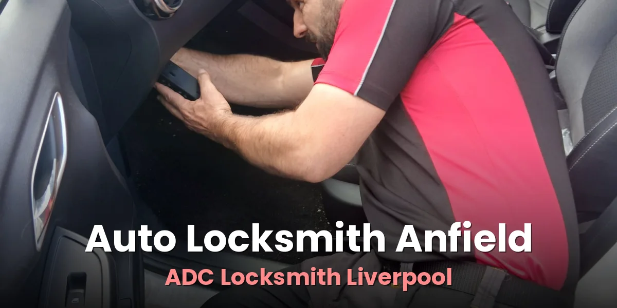 Craig Evans of ADC Locksmith at work on a car key beside a customer vehicle