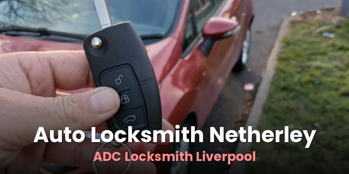 Car key and remote beside a red hatchback after a replacement by ADC Locksmith