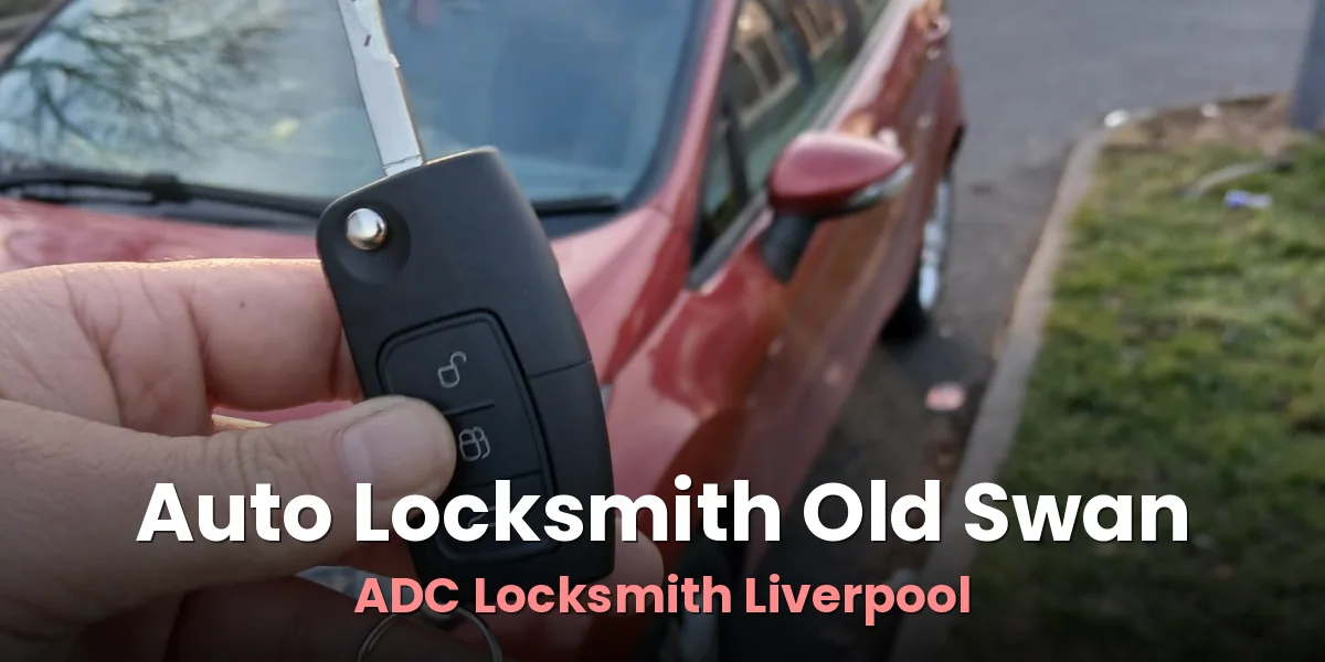 New car key and remote fob shown beside a red hatchback by ADC Locksmith