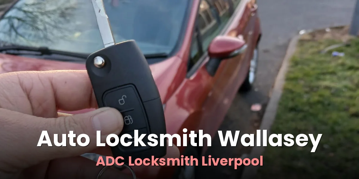 New car key and fob handed over beside a red hatchback