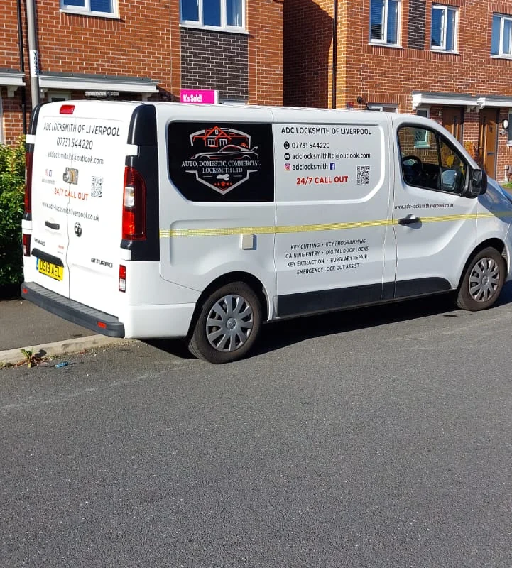 ADC Locksmith van parked outside homes