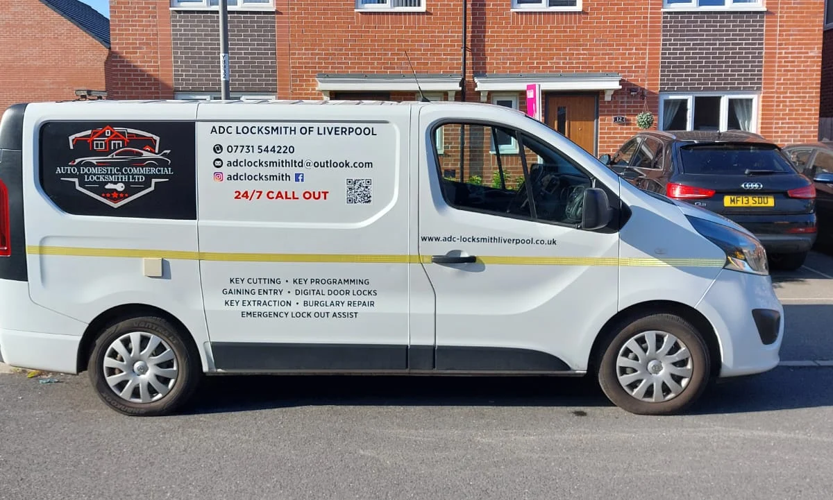 ADC Locksmith mobile van parked on a residential street