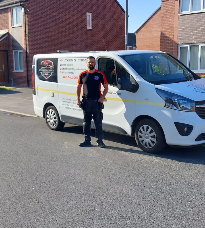 Craig Evans beside the ADC Locksmith van