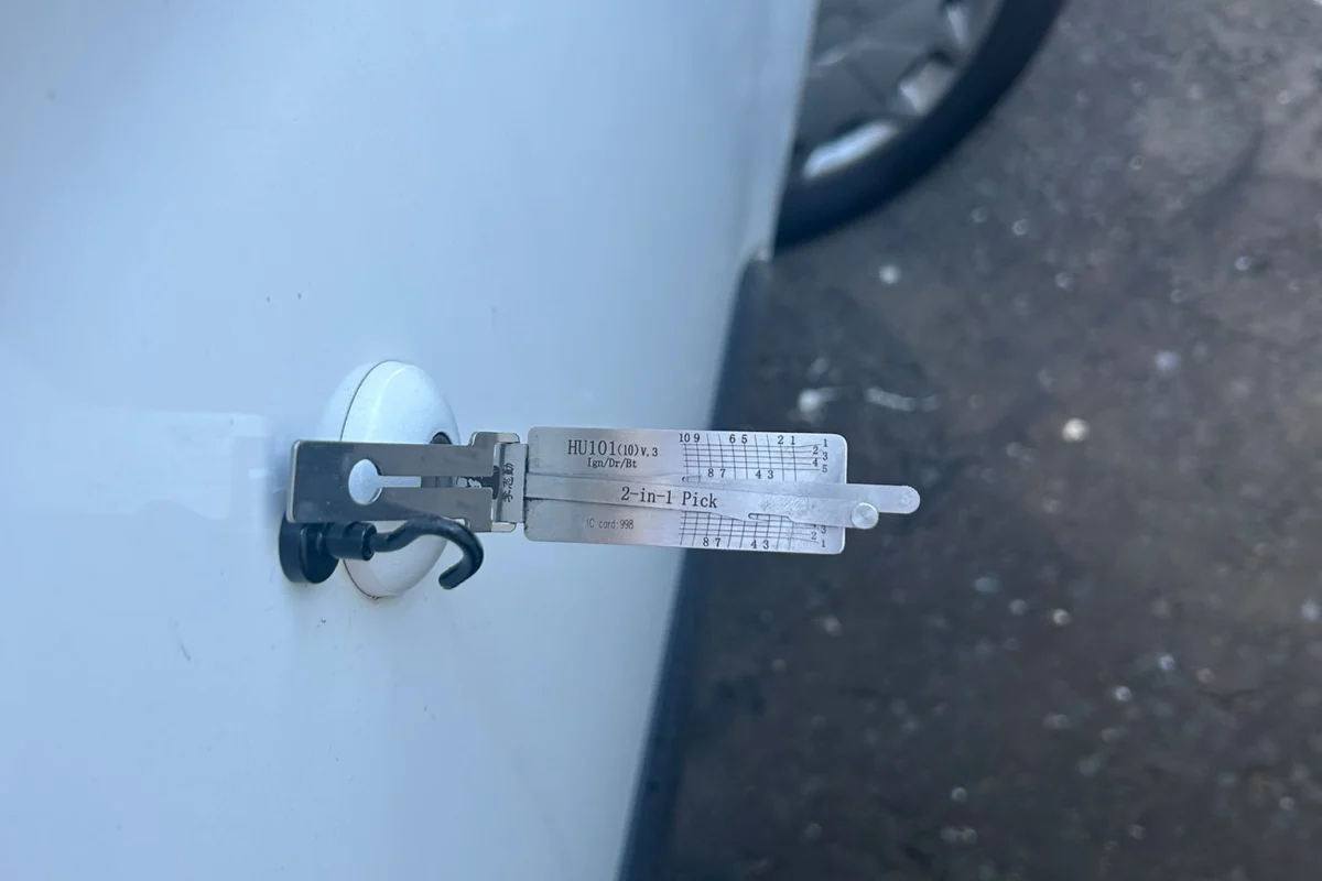 Lock tool in a car door lock during non destructive entry