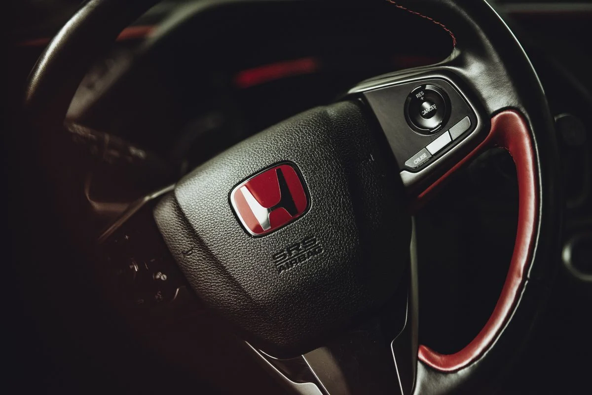 Honda steering wheel with red badge