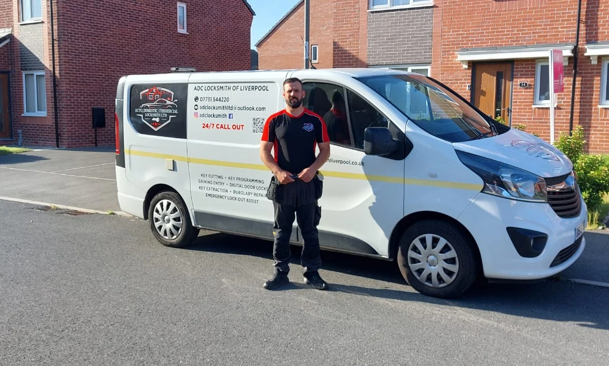 Craig Evans standing beside the ADC Locksmith van