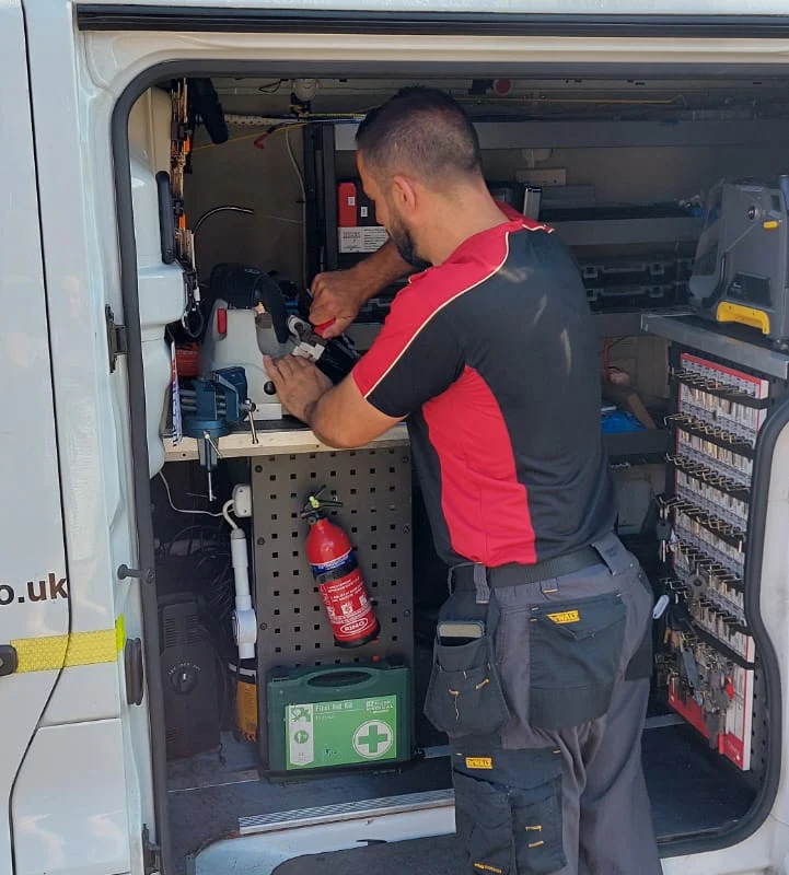Craig Evans working in the ADC Locksmith van workshop