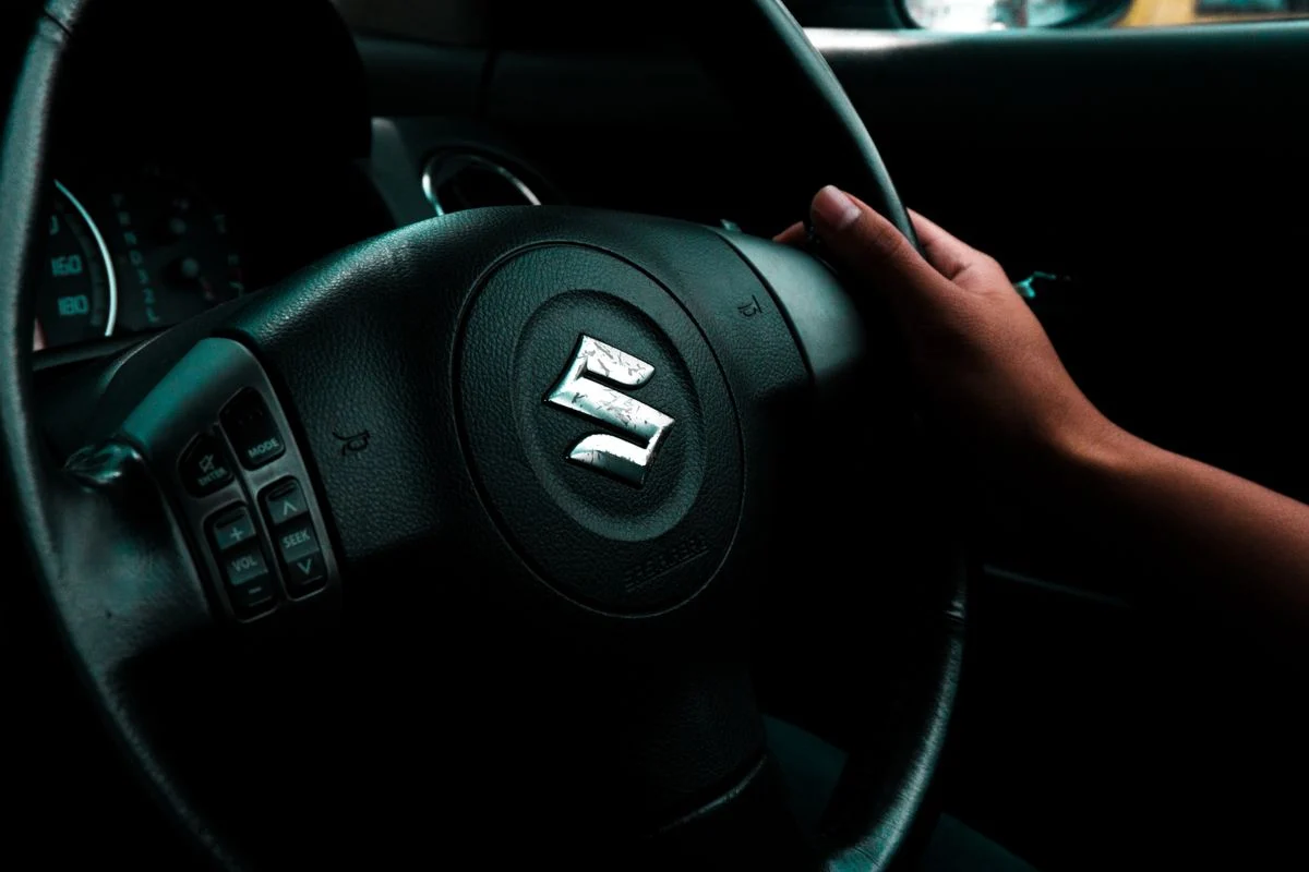 Suzuki steering wheel inside the car