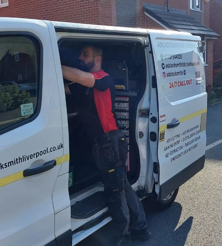Craig Evans at the side door of the ADC Locksmith van